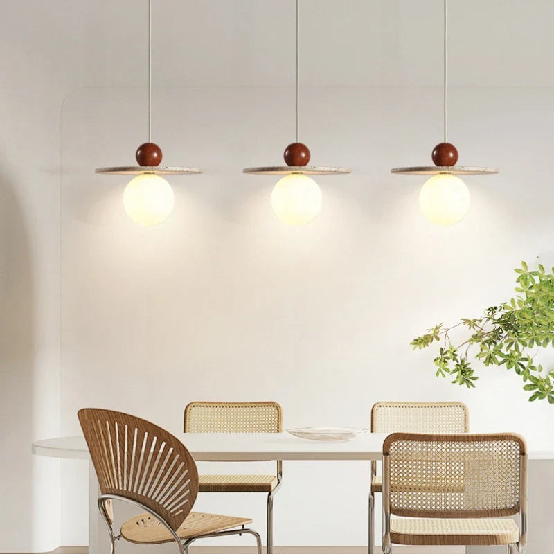 round stone and wood pendant light with adjustable cord for